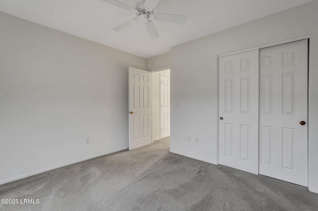 unfurnished bedroom with light colored carpet, ceiling fan, and a closet