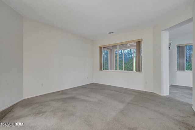 spare room with light colored carpet