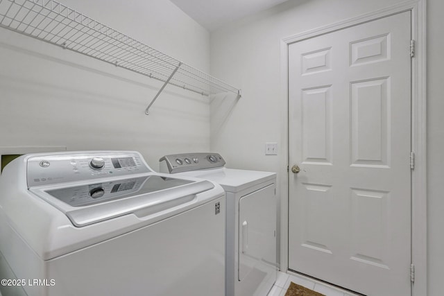 laundry area with washer and clothes dryer