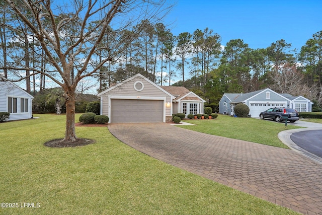 single story home featuring a garage and a front lawn