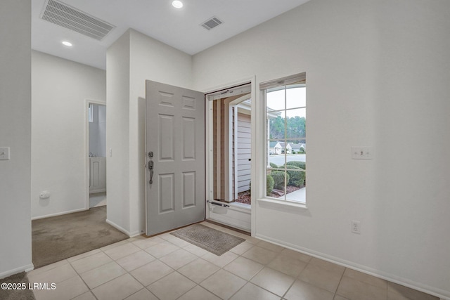 view of carpeted foyer