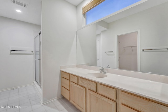 bathroom featuring vanity and walk in shower