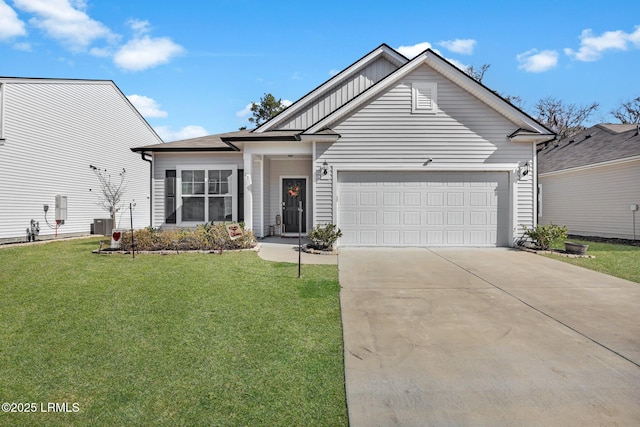 view of front facade with a garage, central AC, and a front yard