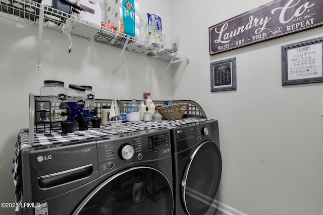 washroom with washing machine and dryer