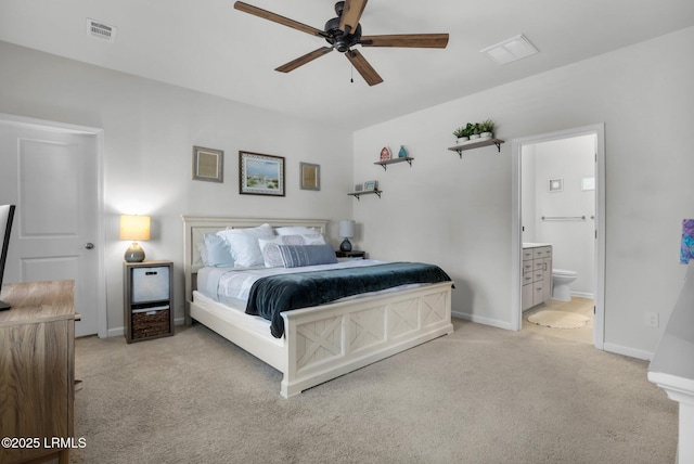 bedroom featuring connected bathroom, light carpet, and ceiling fan