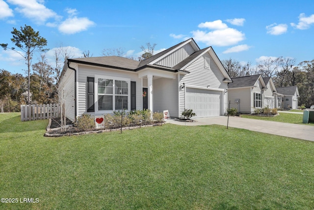 view of front of property with a garage and a front yard