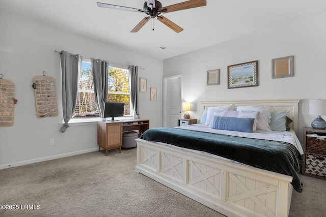 bedroom with ceiling fan and light carpet