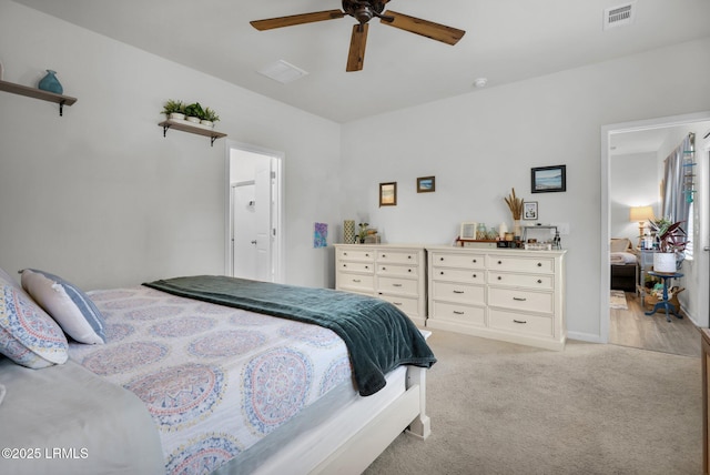 carpeted bedroom with ceiling fan