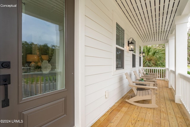 wooden deck featuring covered porch