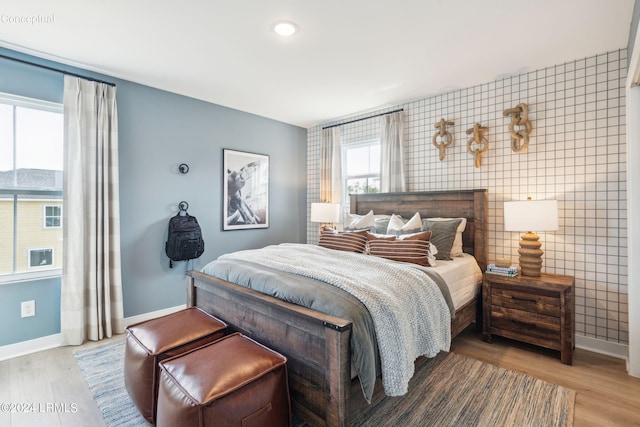 bedroom with light hardwood / wood-style floors