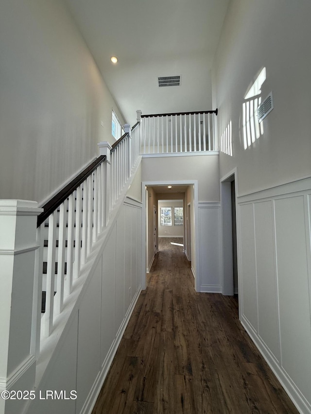 staircase featuring hardwood / wood-style flooring and a healthy amount of sunlight