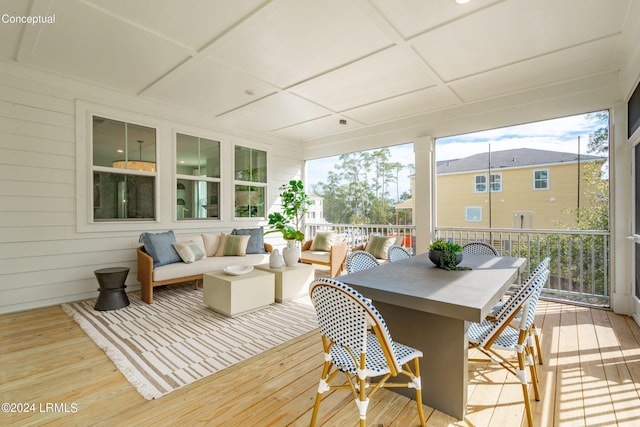 sunroom / solarium featuring coffered ceiling