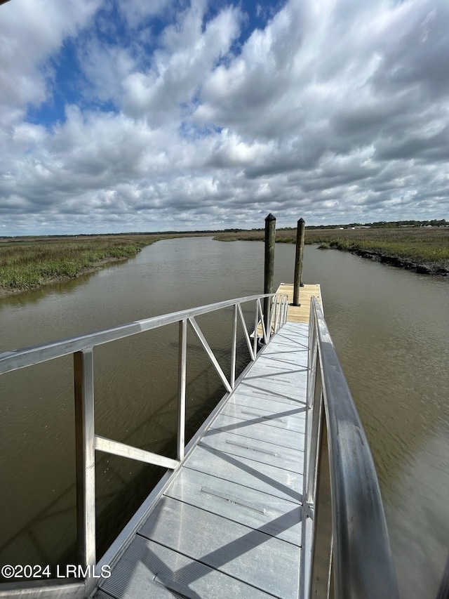 dock area featuring a water view