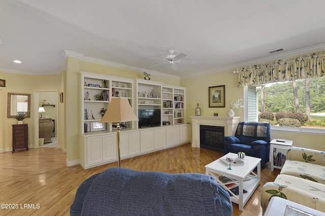 11 Argent Way, Bluffton, SC 29909 - living area with ornamental molding, light wood-style floors, ceiling fan, a fireplace, and baseboards