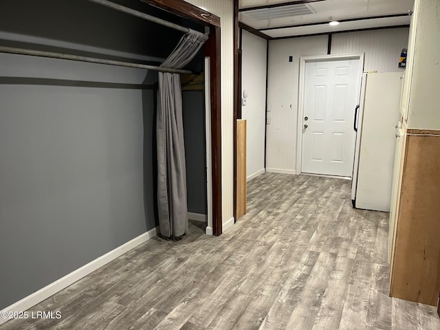 24 James F Byrnes St, Ladys Island, SC 29907 - finished below grade area featuring freestanding refrigerator and wood finished floors