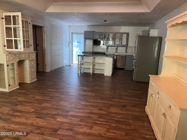 24 James F Byrnes St, Ladys Island, SC 29907 - kitchen featuring appliances with stainless steel finishes, open shelves, dark wood-style floors, and a textured ceiling
