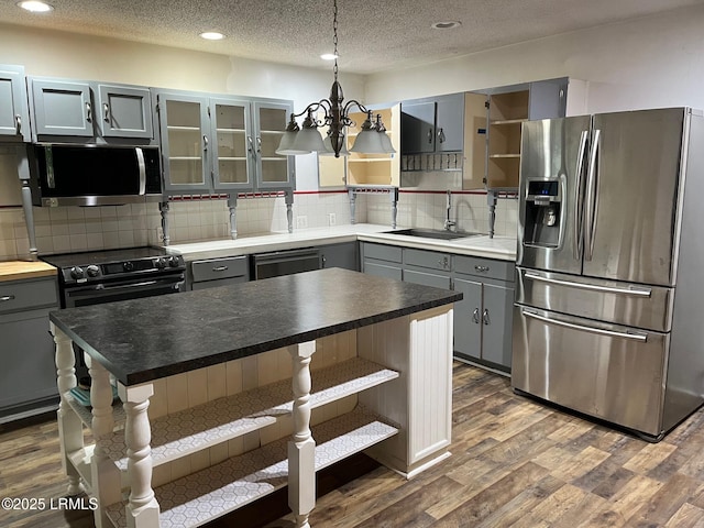 24 James F Byrnes St, Ladys Island, SC 29907 - kitchen featuring appliances with stainless steel finishes, open shelves, gray cabinets, dark wood-style floors, and recessed lighting