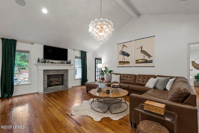 17 Audubon Rd, Ladys Island, SC 29907 - living area with hardwood / wood-style flooring, beam ceiling, a chandelier, a tile fireplace, and high vaulted ceiling