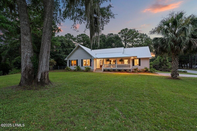 17 Audubon Rd, Ladys Island, SC 29907 - ranch-style home featuring a front lawn, covered porch, and a metal roof
