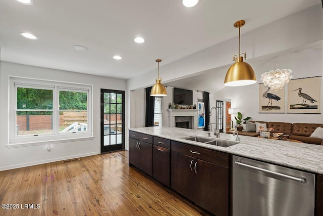 17 Audubon Rd, Ladys Island, SC 29907 - kitchen featuring open floor plan, dishwasher, a fireplace, light wood-type flooring, and recessed lighting