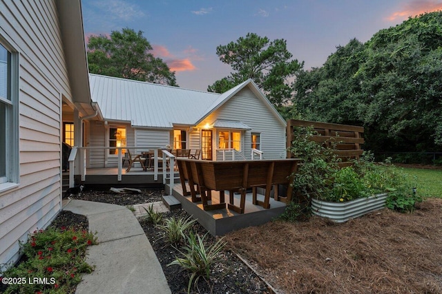 17 Audubon Rd, Ladys Island, SC 29907 - rear view of property with a wooden deck, a metal roof, and a vegetable garden