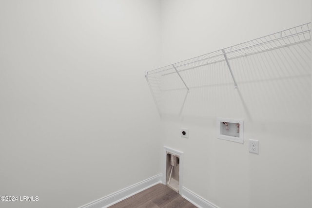 laundry area with washer hookup, hookup for an electric dryer, and wood-type flooring