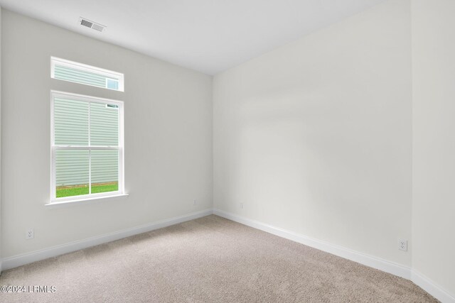 unfurnished room with carpet flooring