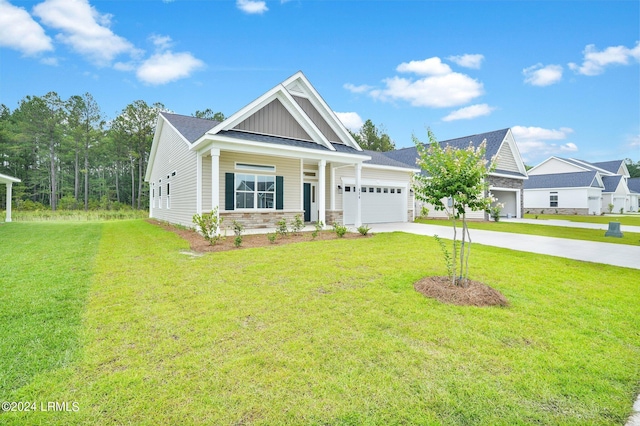 craftsman-style home with a garage and a front lawn