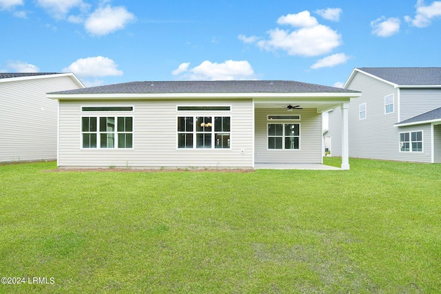 back of property featuring a patio area, ceiling fan, and a lawn