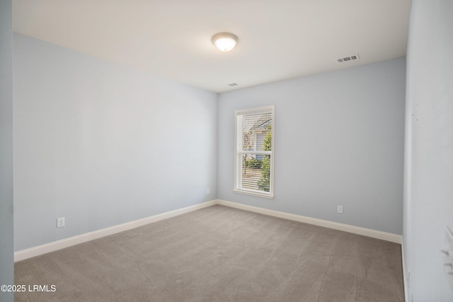 empty room with light colored carpet