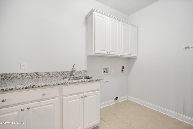 laundry area with sink, cabinets, light tile patterned floors, hookup for a washing machine, and hookup for an electric dryer