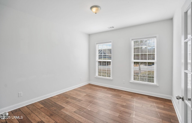 empty room featuring hardwood / wood-style flooring