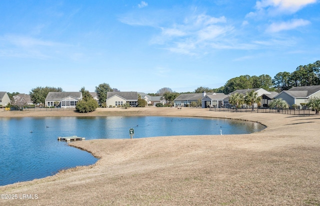 view of pool with a water view