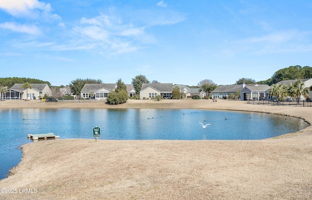 view of swimming pool with a water view