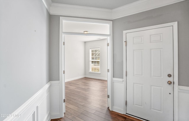 hallway featuring crown molding and hardwood / wood-style flooring