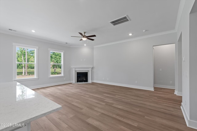 41 Fairfield Rd, Beaufort, SC 29907 - unfurnished living room featuring visible vents, ornamental molding, a fireplace with flush hearth, and ceiling fan