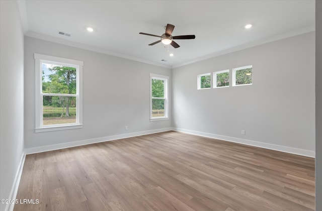 41 Fairfield Rd, Beaufort, SC 29907 - spare room with crown molding, visible vents, a ceiling fan, and a healthy amount of sunlight