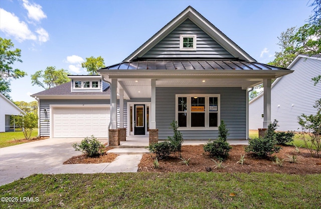 41 Fairfield Rd, Beaufort, SC 29907 - view of front of home with a porch, a standing seam roof, metal roof, a garage, and concrete driveway