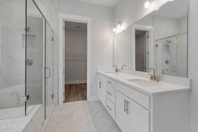 41 Fairfield Rd, Beaufort, SC 29907 - full bathroom with a walk in closet, a marble finish shower, a sink, and marble finish floor