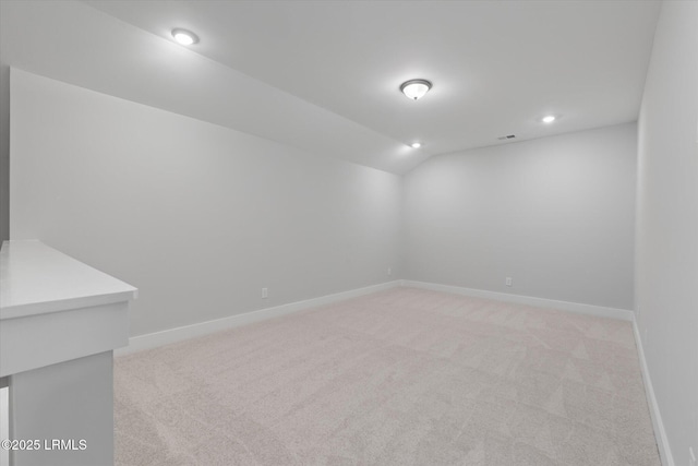 41 Fairfield Rd, Beaufort, SC 29907 - empty room featuring visible vents, light colored carpet, baseboards, lofted ceiling, and recessed lighting