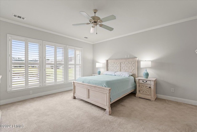 carpeted bedroom featuring ceiling fan and ornamental molding