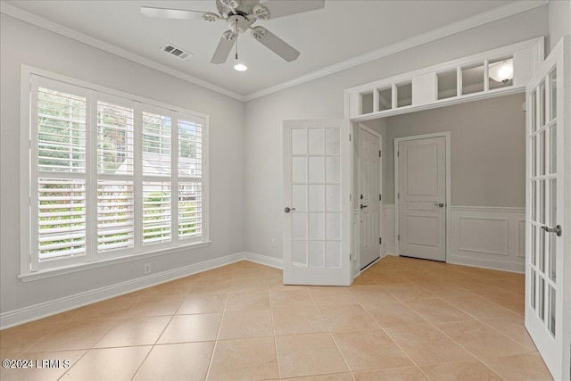 tiled spare room with french doors, ceiling fan, and ornamental molding