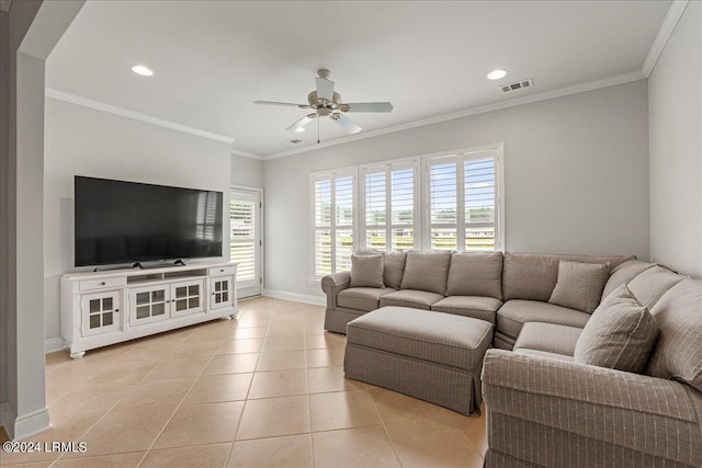 tiled living room with ornamental molding and ceiling fan