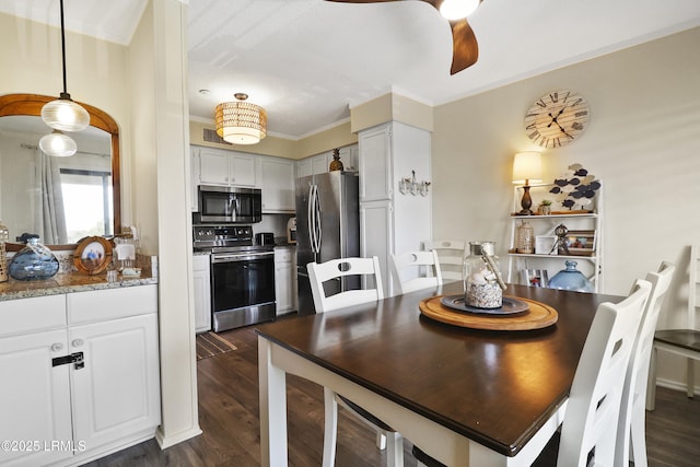40 Folly Field Rd Unit 340, Hilton Head Island, SC 29928 - dining space featuring a ceiling fan, dark wood-style floors, and ornamental molding