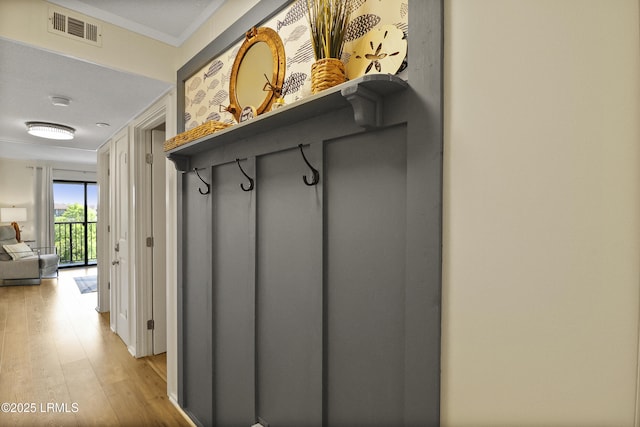 40 Folly Field Rd Unit 340, Hilton Head Island, SC 29928 - mudroom with light wood-style flooring and ornamental molding