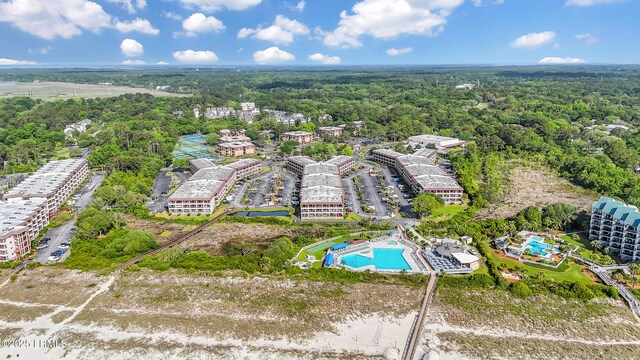 40 Folly Field Rd Unit 340, Hilton Head Island, SC 29928 - drone / aerial view of a pool and a heavily wooded area