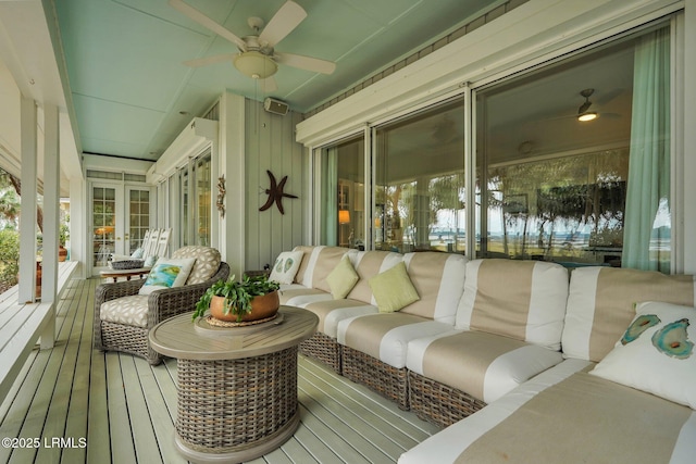 exterior space with an outdoor living space and a ceiling fan