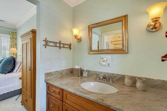 ensuite bathroom with visible vents, ornamental molding, connected bathroom, and vanity