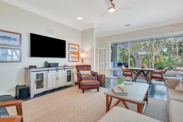 living room with ornamental molding, visible vents, ceiling fan, and tile patterned floors