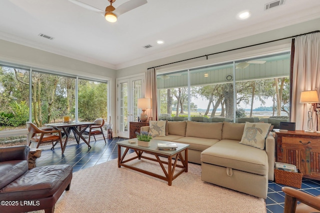 sunroom / solarium featuring a healthy amount of sunlight and visible vents